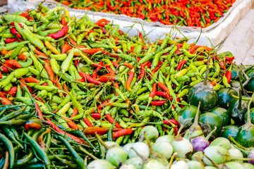 Sticker - red chili peppers in the market, digital photo picture as a background