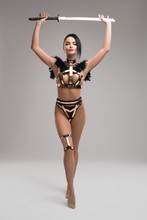 Slim Female Warrior In Stylish Metal Underwear