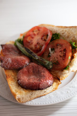 Wall Mural - fresh turkish sausage in bread with tomato