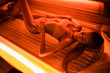 © F8  \ Suport Ukraine - Beautiful young woman tanning skin treatment in modern solarium