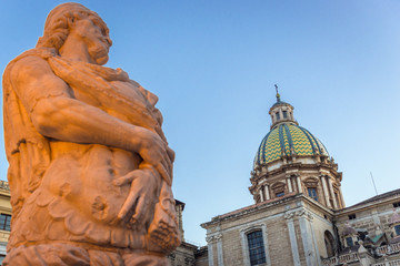 Poster - One of the statues of Praetorian Fountain and Church of San Giuseppe dei Teatini located on Pretoria Square, Square of Shame in Palermo, Italy