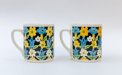 Two retro midcentury design mug with floral pattern - isolated on white background