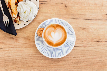 close up of latte coffee on table in a cafe at breakfast time