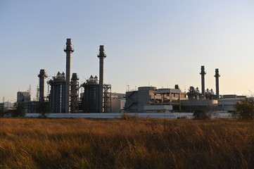 Natural gas combine cycle power plant and turbine generator in dusk with  twilight