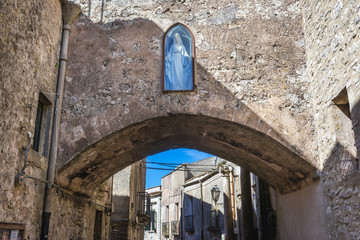 Canvas Print - Small shrine in a building wall in Erice, small town located on a mountain near Trapani city, Sicily Island in Italy