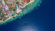 Aerial View Local Living Of Philippines At Moalboal A Small Town On Cebu Island, Moalboal Is A Deep Clean Blue Ocean And Has Many Local Filipino Boats In The Sea. Moalboal, Cebu, Philippines.