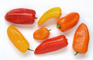 Fresh colorful bell peppers isolated on white background