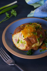 Wall Mural - Twice Baked Potatoes with Bacon, Cheese and  Scallion. Potato in jacket. Vertical image