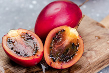 Tamarillo Or Tree Tomato Exotic Fruit. Whole And Cut Tamarillo Fruit
