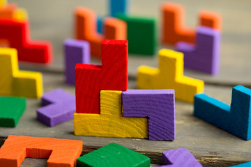 Creative solution for idea - business concept, jigsaw puzzle on the wooden desk