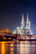Cologne at night with illuminated Cologne Cathedral, Hohenzollern Bridge and Rhine River