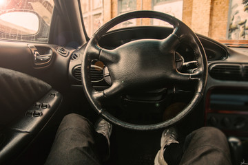 Wall Mural - Car driver driving during the day in a leather interior.