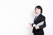© garage38 - ポイントを指し示すスーツ姿の女性