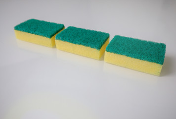 Yellow green cleaning sponge isolated on white background - Spring cleaning theme