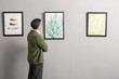 © Pixel-Shot - Man at exhibition in modern art gallery
