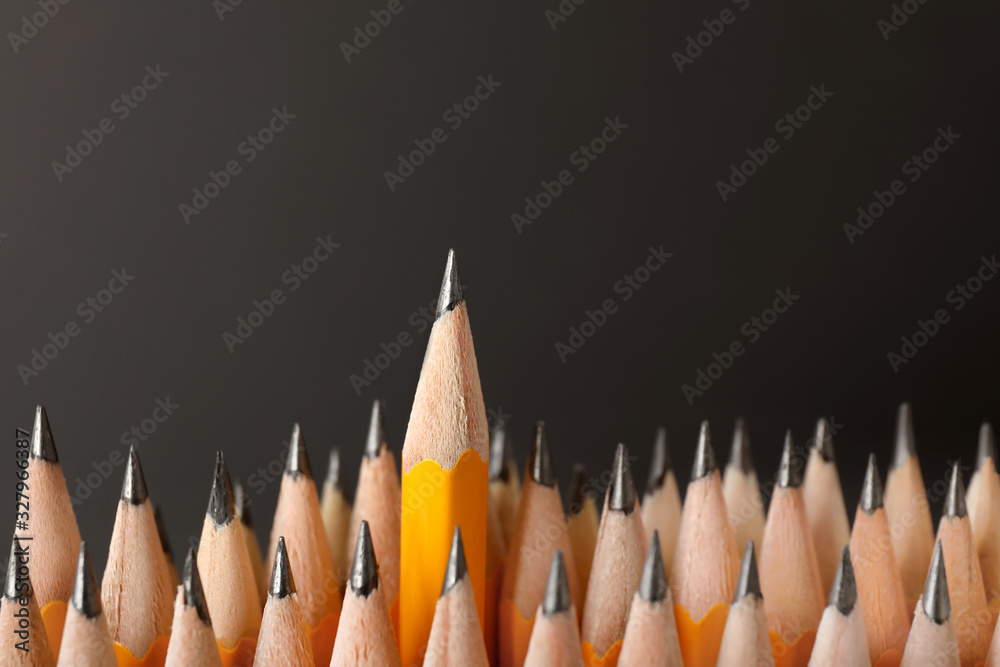 Many pencils on dark background