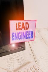 Poster - Conceptual hand writing showing Lead Engineer. Concept meaning control his team and manage phases of the project in hand Notation paper computer monitor screen near white keyboard