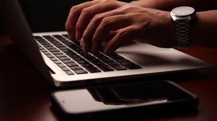 Aufkleber - Closeup of a businessman hands working and typing on laptop keyboard in slow motion