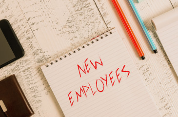 Wall Mural - Text sign showing New Employees. Business photo showcasing has not previously been employed by the organization Smartphone man wallet notebook pens ballpoints note pad old wooden table