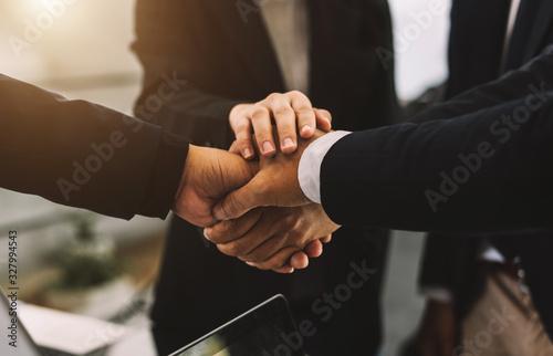 Close up on hands of business people join together their hands together on unity Poster Mural XXL