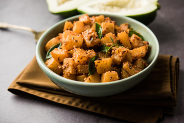 Wall Mural - Kaccha Papita Sabji or Raw Papaya Sabzi, served in a karahi or bowl. selective focus