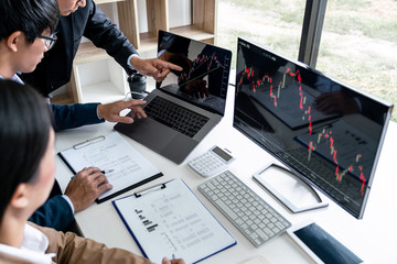 Poster - Business team partner working with computer, laptop, discussion and analyzing graph stock market trading with stock chart data planning, financial and investment concept