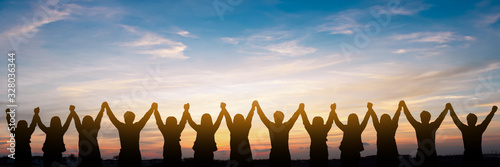 Fotografía Silhouette of group happy business team making high hands over head in beautiful
