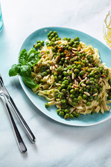 Wall Mural - spring homemade Italian pasta with chickpea flour and pesto with fresh green peas and pine nuts. delicious mediterranean cuisine