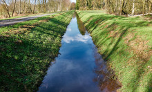Drainage Ditch To Drain The Moor Area, With Embankments With Grass