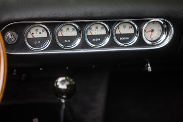 Wall Mural - Clock, fuel level and thermometer on a vintage car's dashboard