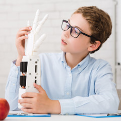 Poster - Little technician experimenting with humanoid robotic hand