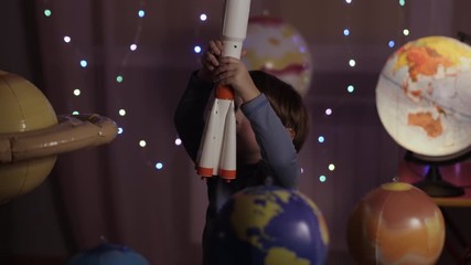 Wall Mural - Space Travel Game Inspiration Spaceship. Little Kid Boy Astronaut Launching Toy Rocket From Spaceport Through Planets. Child Dreamer Playing With Toy Space Rocket Flying Among Planets. SLOW MOTION.