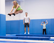 © JackF - Woman jumping in trampoline center