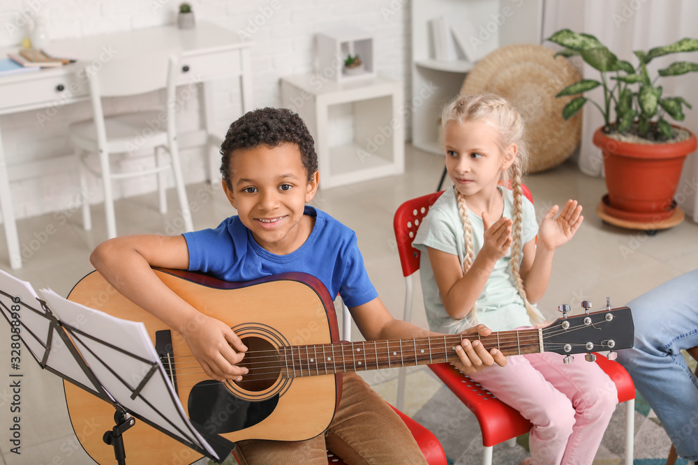 Cute little children at music school