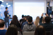 © Right 3 - Business coach. Team leader teaches employees at a business meeting in a conference room. Speaker giving a talk at a corporate business seminar. Audience in hall with presenter in lecture photo.
