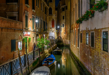 Fototapete - Narrow canal with bridge in Venice, Italy. Architecture and landmark of Venice. Night cozy cityscape of Venice.