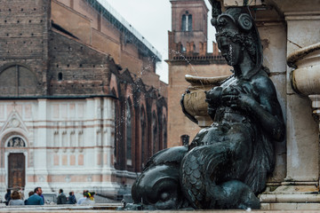 Wall Mural - Detail with a lactating nereid of Fountain of Neptune (Fontana di Nettuno) located in  Piazza del Nettuno in Bologna, Italy. Architecture and landmark of Bologna. Cityscape of Bologna.