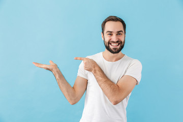 Sticker - Portrait of a young cheerful bearded man wearing t-shirt