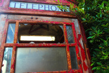 The Old Red Public Telephone Box Is Damaged