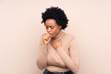 African american woman over isolated background is suffering with cough and feeling bad