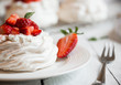 Delicious Pavlova cake with meringue and fresh strawberries
