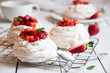 Delicious Pavlova cake with meringue and fresh strawberries