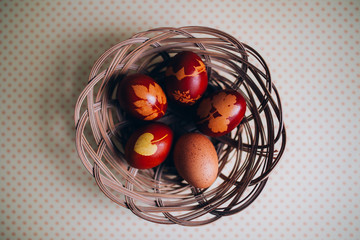 Traditionally dyed Easter eggs dyed with onion peels with a pattern of plants.