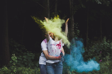 positive couple throws bright colors on Holi holiday