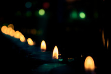Unfocused Set Of Religious Candles In A Mountain Sanctuary