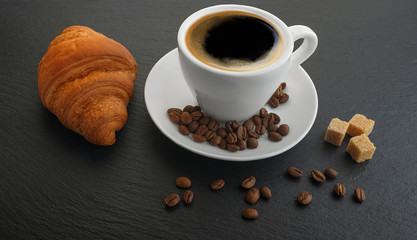 Wall Mural - white cup with coffee and coffee grains cookies on black slate blackboard