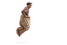 Profile Shot Of A Senior Man Jumping In A Sack