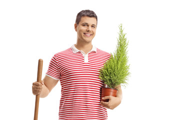 Wall Mural - Guy with a shovel and a plant