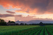 © Cavan Images - Clearing storm over a rural landscape with a traditional barn.
