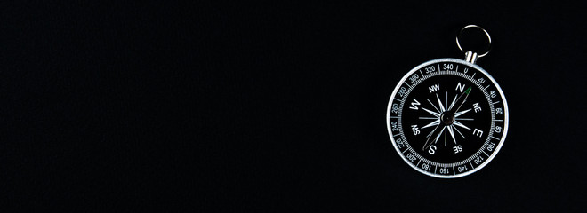 old compass on a black background. copy space for text or design